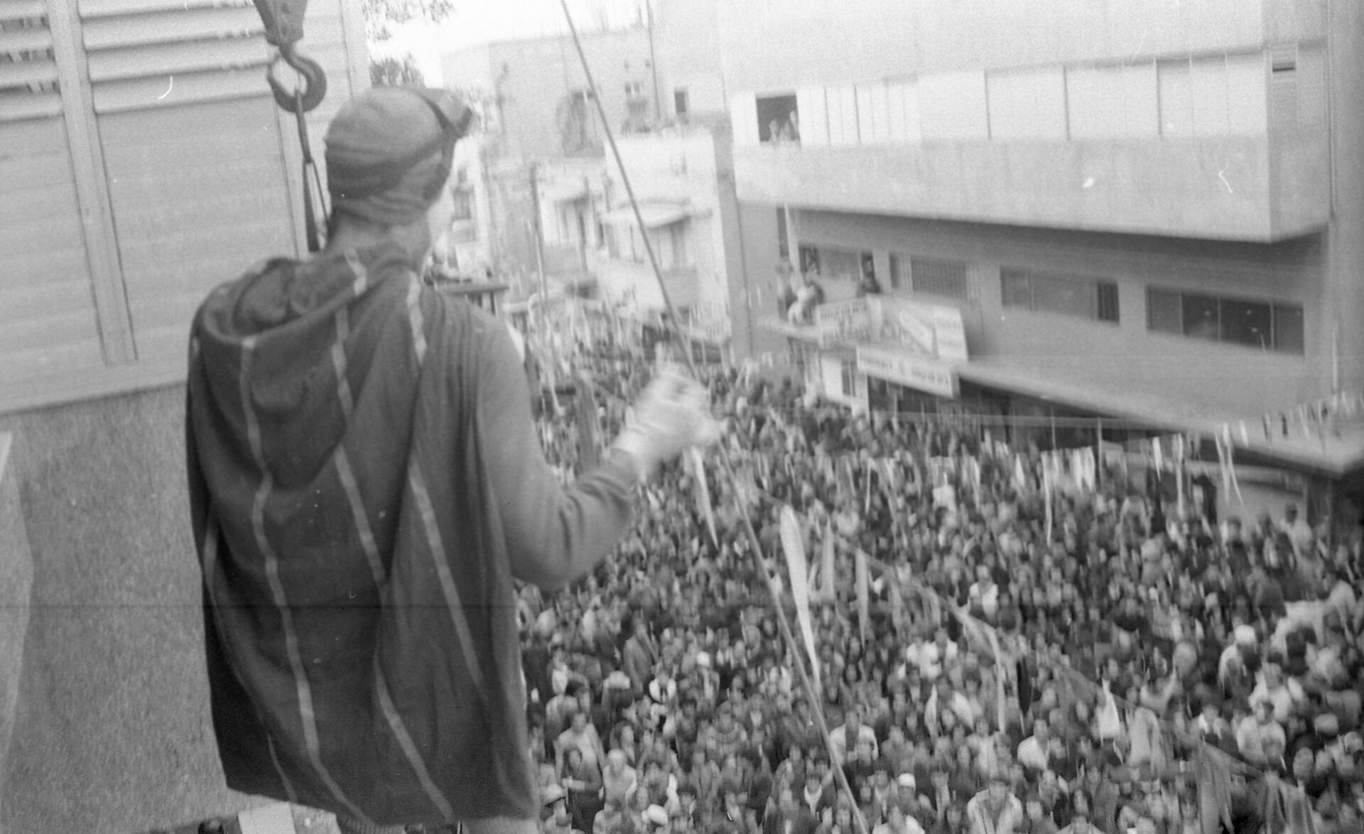 Purim street celebration in Israel with costumed people gathered in public, 1984