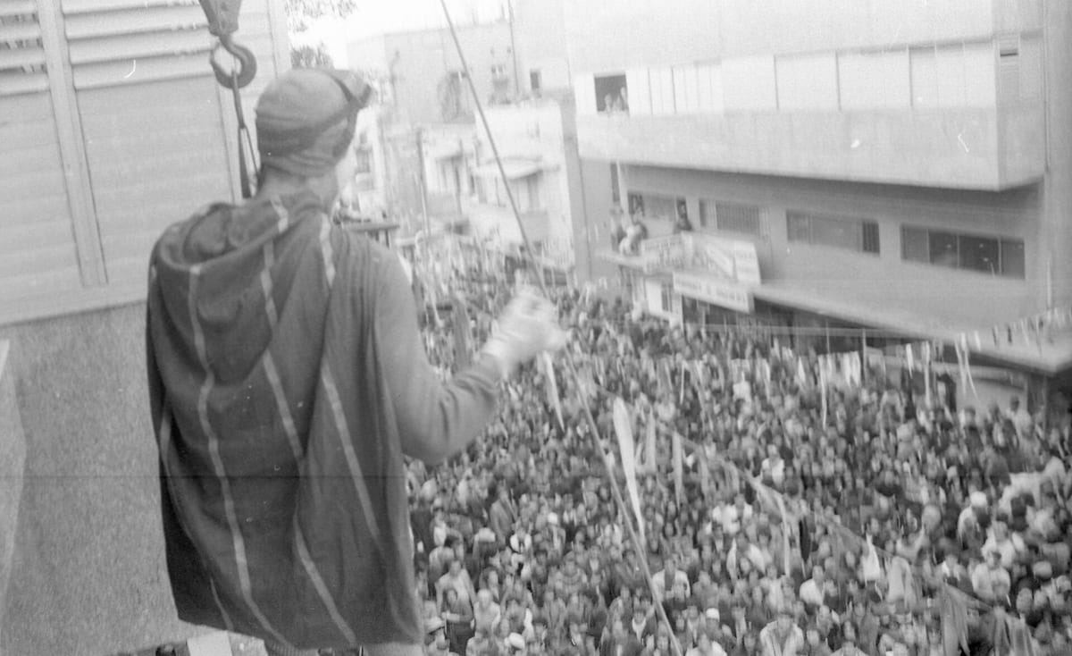 Purim street celebration in Israel with costumed people gathered in public, 1984
