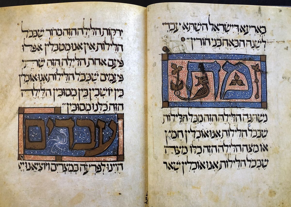 Spread from a medieval illuminated Hebrew Haggadah manuscript