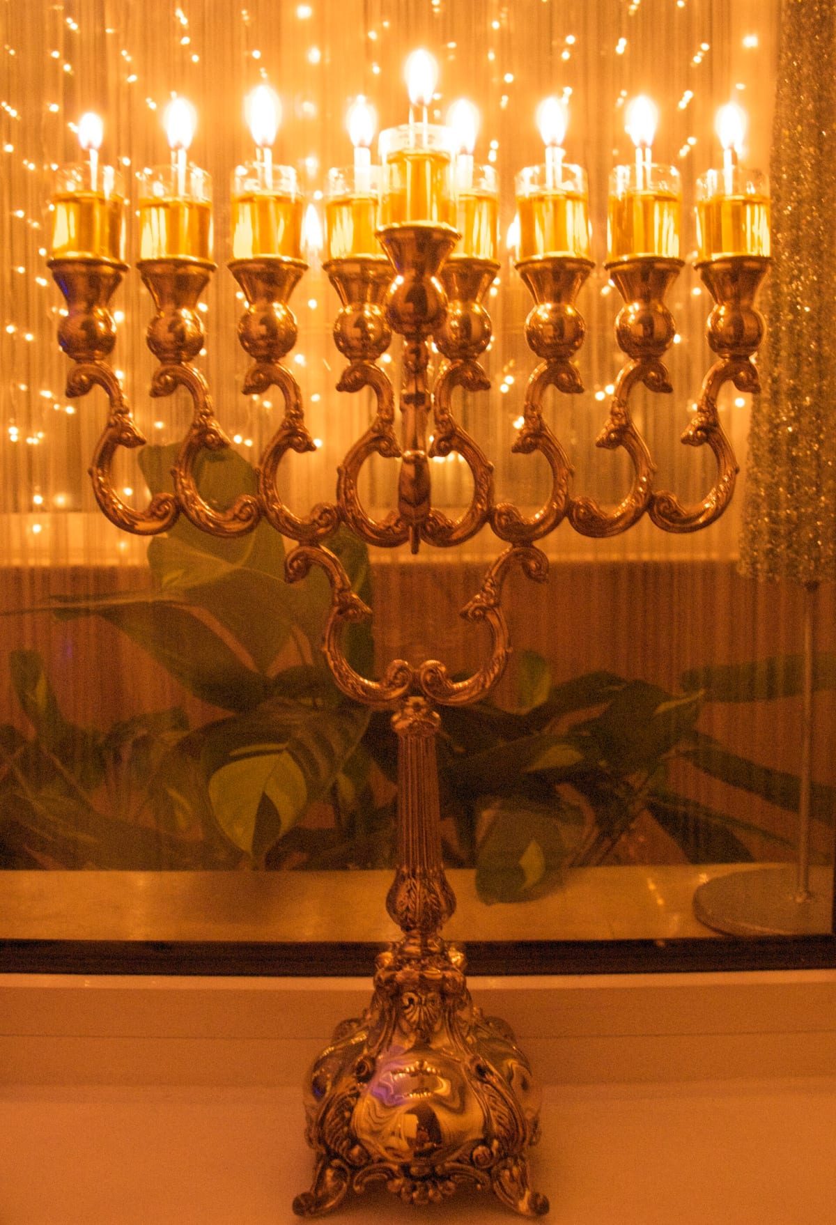 A sterling-silver Hanukkah menorah (eight-branched candelabrum) lit for the holiday