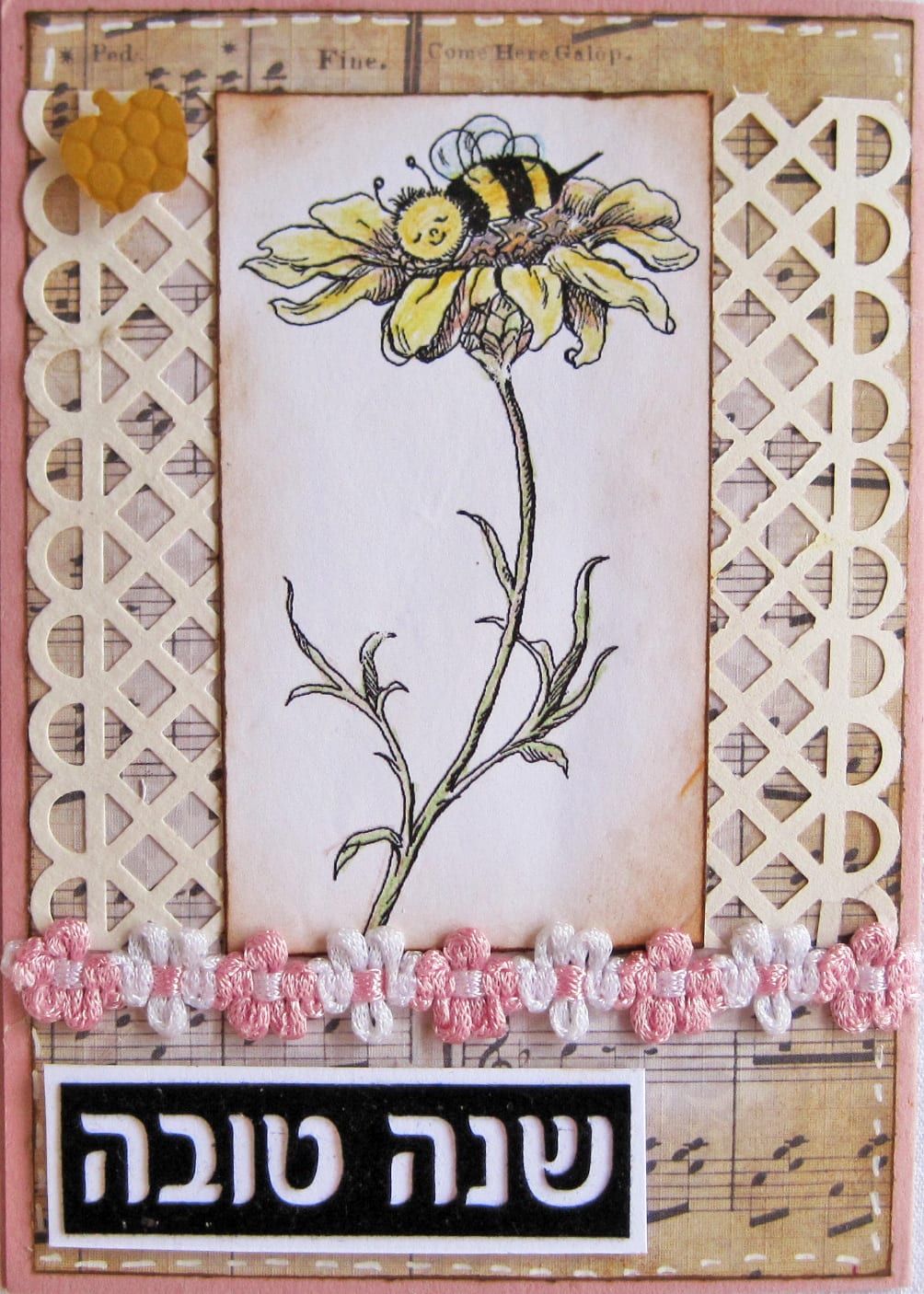 A handmade Rosh Hashanah greeting card reading "Shanah Tovah" in Hebrew, decorated with a honeybee illustration
